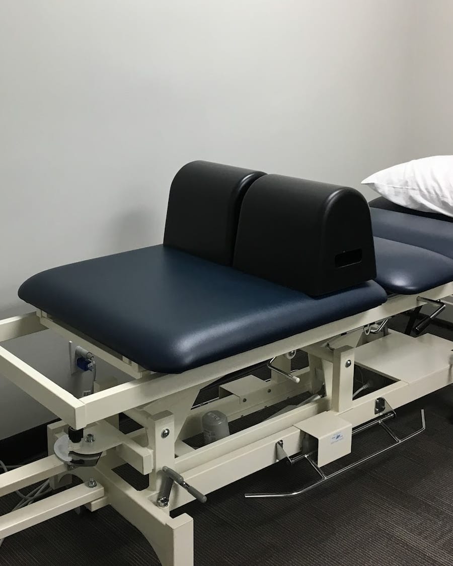 A treatment room at Peak Physical Therapy, with a traction table made up and ready